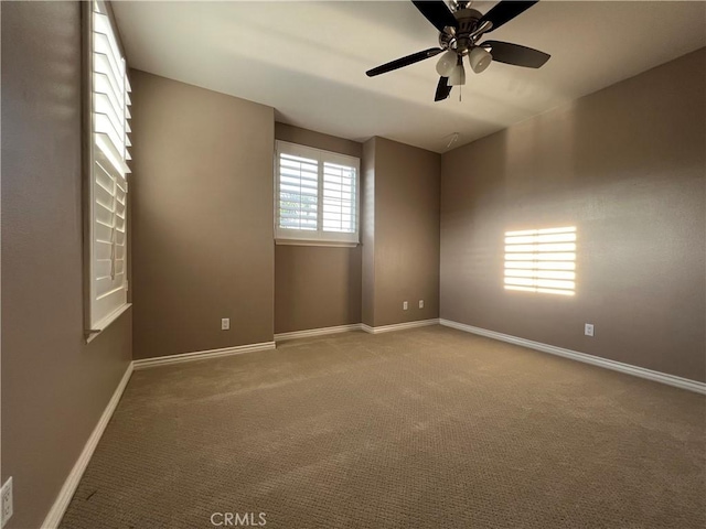 unfurnished room with carpet floors and ceiling fan