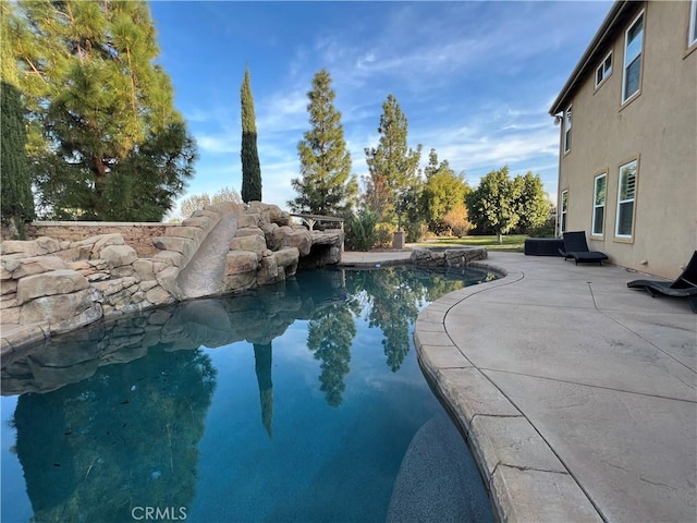 view of pool featuring a patio area