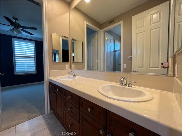 bathroom with ceiling fan, vanity, and tile patterned floors