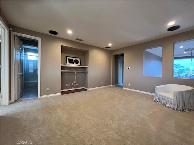 unfurnished living room with light carpet