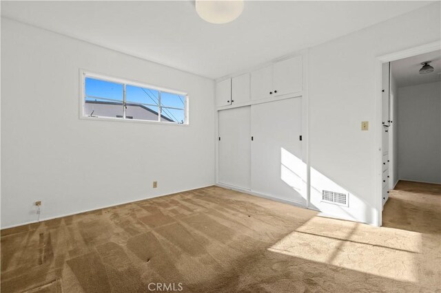 unfurnished room featuring carpet floors