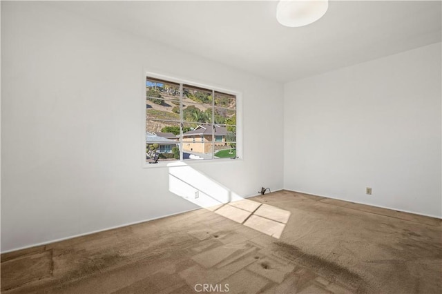 unfurnished room featuring carpet floors