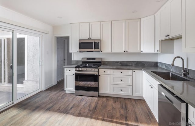 kitchen featuring sink, white cabinets, and stainless steel appliances