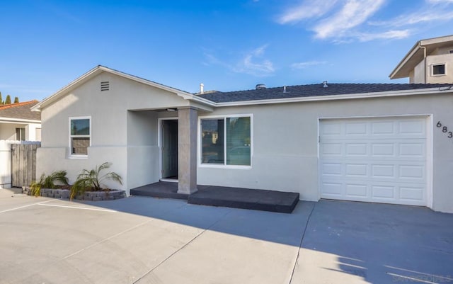 ranch-style house featuring a garage