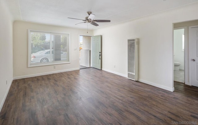 empty room with ceiling fan and dark hardwood / wood-style floors