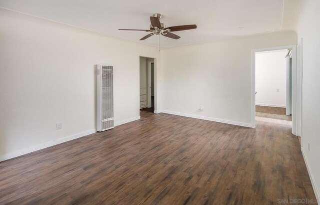 unfurnished room with ceiling fan and dark hardwood / wood-style flooring