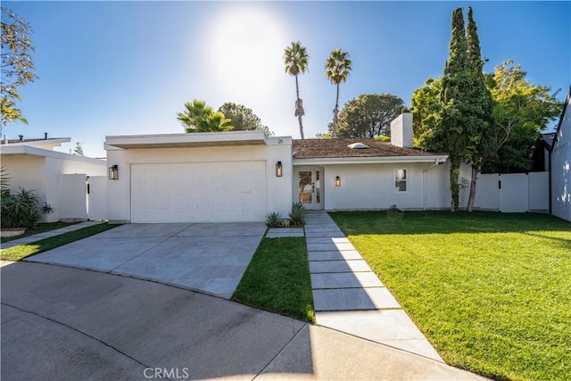 ranch-style house with a front yard and a garage