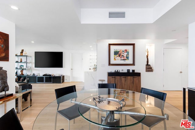 dining area with light hardwood / wood-style floors