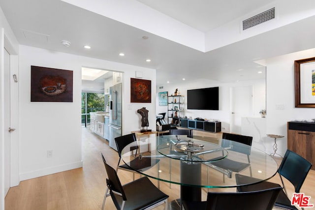 dining space featuring light hardwood / wood-style floors