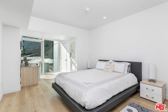 bedroom with light hardwood / wood-style floors