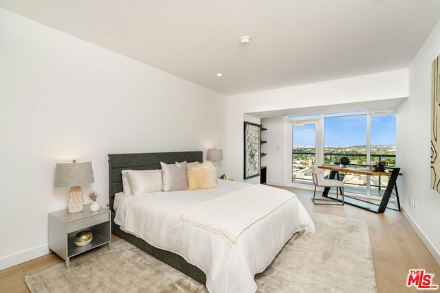 bedroom with light hardwood / wood-style floors