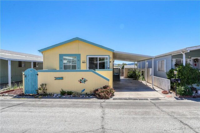 manufactured / mobile home featuring a carport