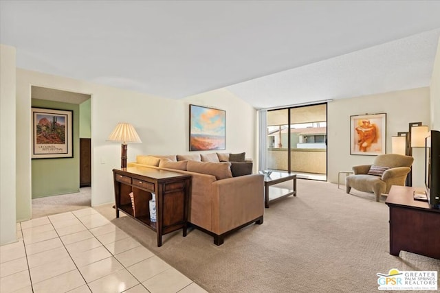 living room with lofted ceiling and light colored carpet