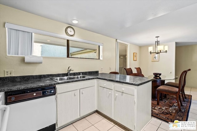 kitchen featuring kitchen peninsula, sink, white dishwasher, hanging light fixtures, and white cabinets