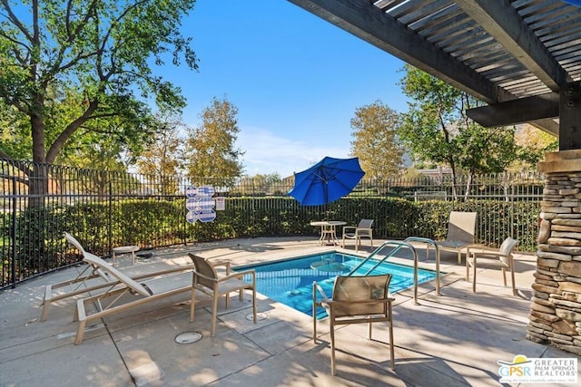 view of swimming pool featuring a pergola and a patio area