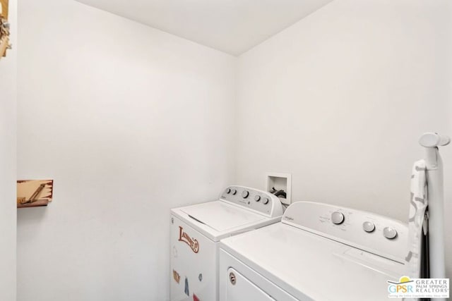 clothes washing area featuring washer and dryer