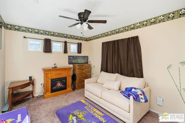 living room with ceiling fan and carpet