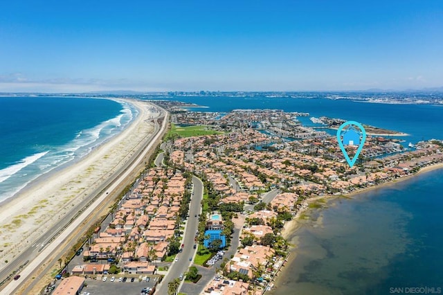 aerial view featuring a water view and a view of the beach