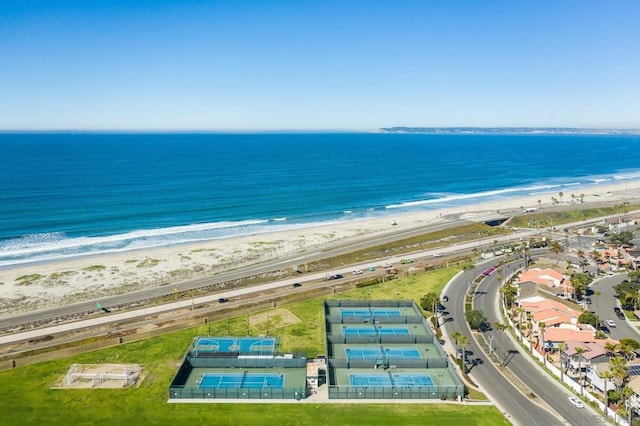 birds eye view of property featuring a water view and a view of the beach