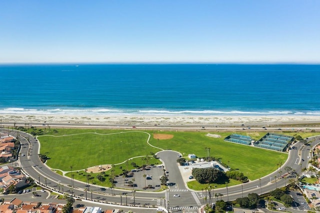 aerial view with a water view and a view of the beach