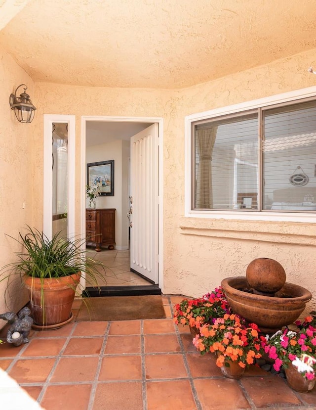 doorway to property with a patio area