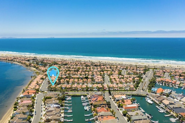 aerial view featuring a view of the beach and a water view