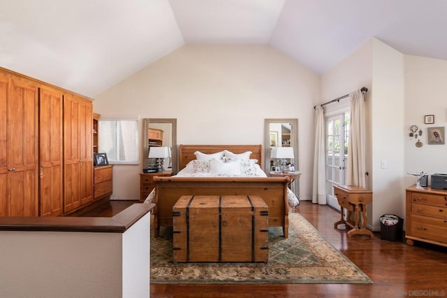 bedroom with vaulted ceiling and dark hardwood / wood-style floors