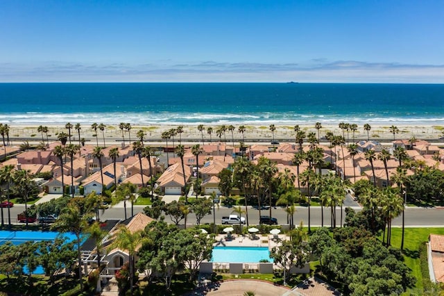 aerial view with a water view and a beach view