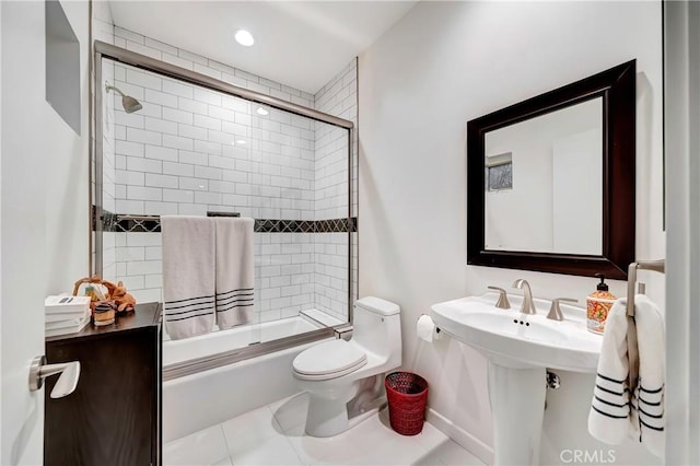 bathroom featuring enclosed tub / shower combo, tile patterned flooring, toilet, recessed lighting, and baseboards