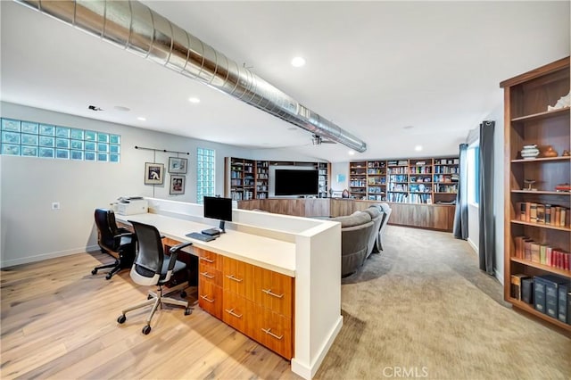 home office featuring baseboards, built in shelves, light wood-style flooring, and recessed lighting