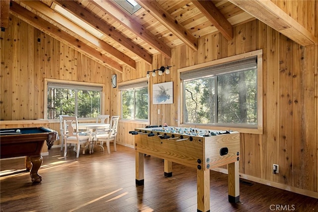 recreation room with wood-type flooring, lofted ceiling with skylight, wood walls, and wood ceiling