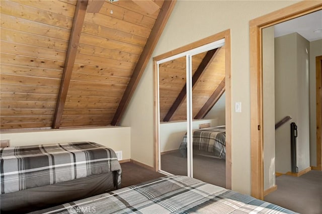 unfurnished bedroom with a closet, wood ceiling, and vaulted ceiling with beams