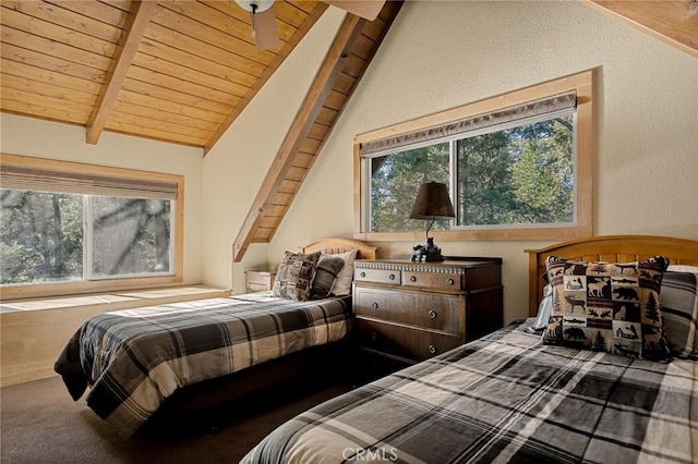 carpeted bedroom with lofted ceiling with beams and wood ceiling