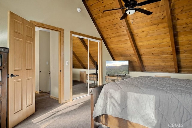 carpeted bedroom featuring ceiling fan, vaulted ceiling with beams, a closet, and wooden ceiling