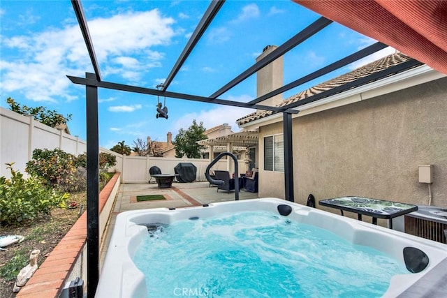 view of pool with a pergola and a hot tub