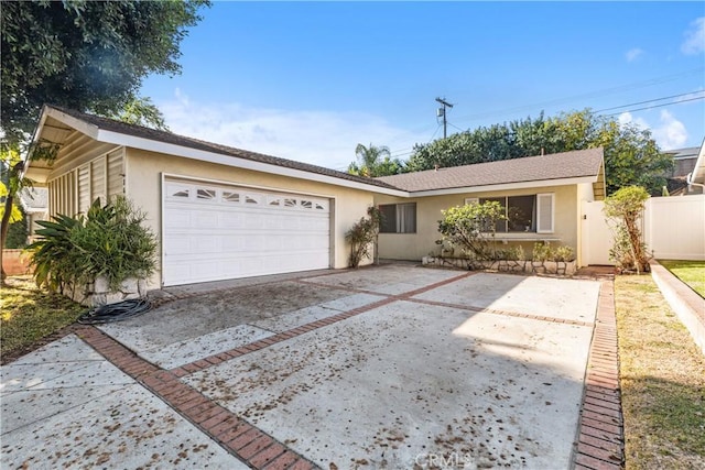 ranch-style house featuring a garage