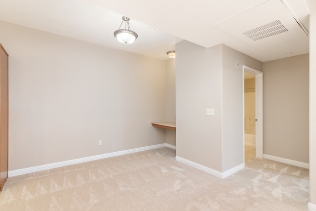 spare room with light colored carpet