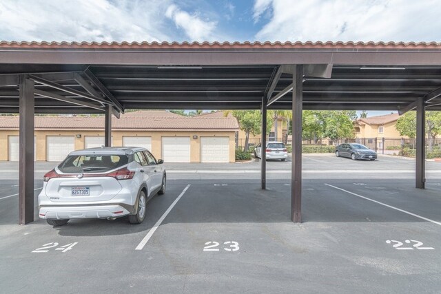 view of vehicle parking featuring a carport