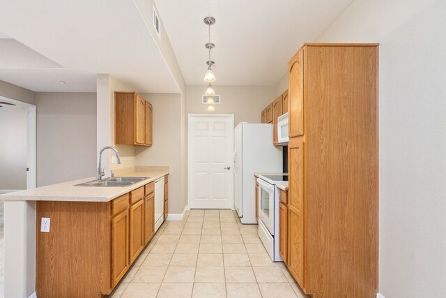 kitchen with light tile patterned floors, kitchen peninsula, white appliances, pendant lighting, and sink