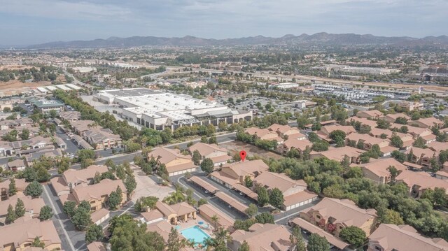 birds eye view of property with a mountain view