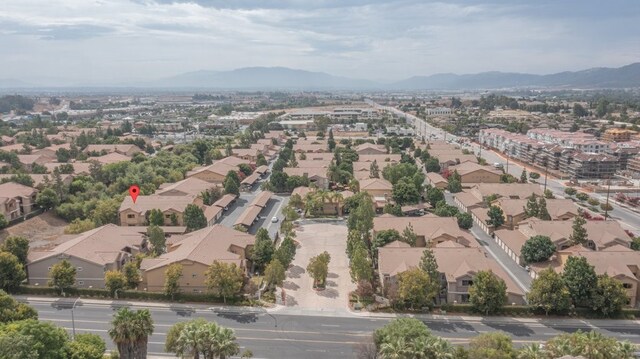 birds eye view of property featuring a mountain view