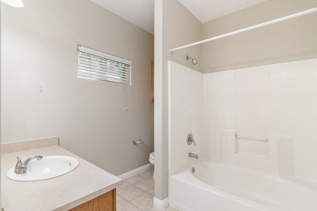 full bathroom featuring toilet, vanity, tile patterned flooring, and bathtub / shower combination