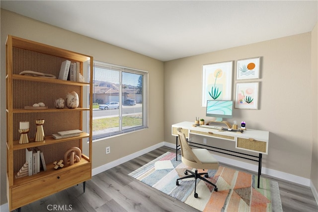 home office with hardwood / wood-style flooring