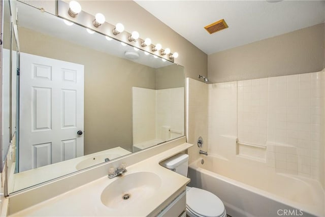 full bathroom with shower / tub combination, vanity, and toilet