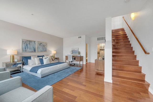 bedroom with hardwood / wood-style floors