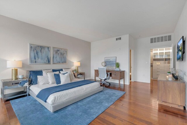 bedroom with hardwood / wood-style flooring