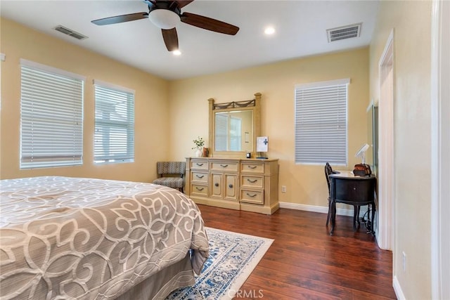 bedroom with ceiling fan and dark hardwood / wood-style floors