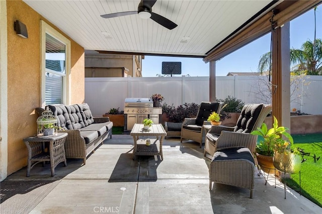 view of patio with an outdoor hangout area, area for grilling, ceiling fan, and a fenced backyard