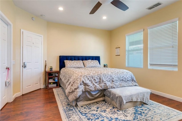 bedroom with visible vents, wood finished floors, baseboards, and recessed lighting