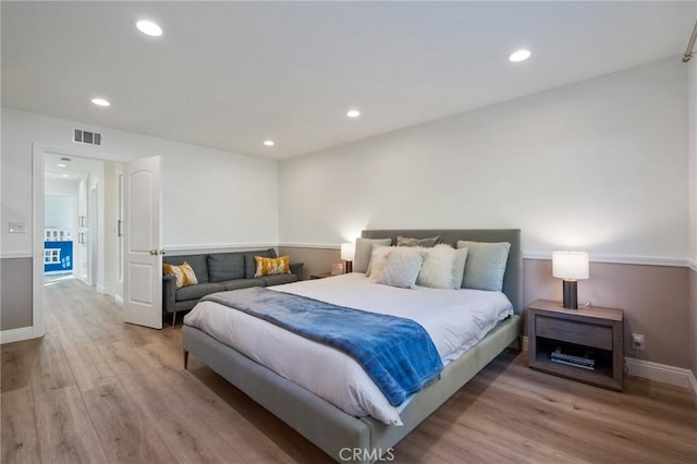 bedroom featuring light hardwood / wood-style floors